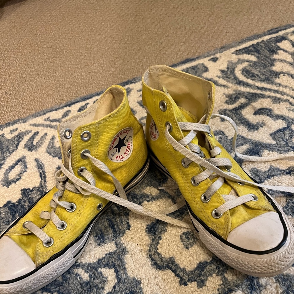 Bright yellow converse high tops